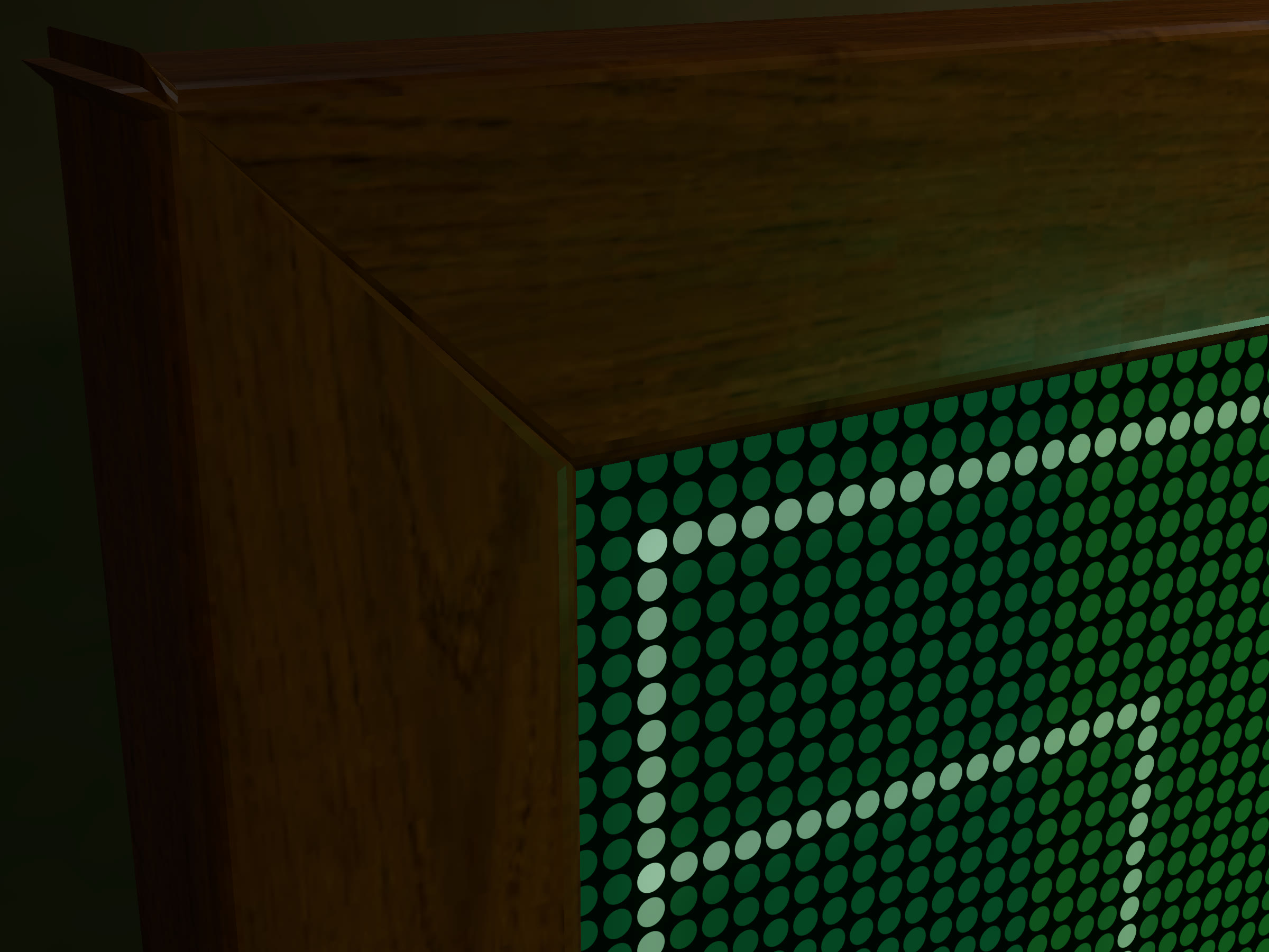 The walnut frame's mitred corner beside the lit LED dots.